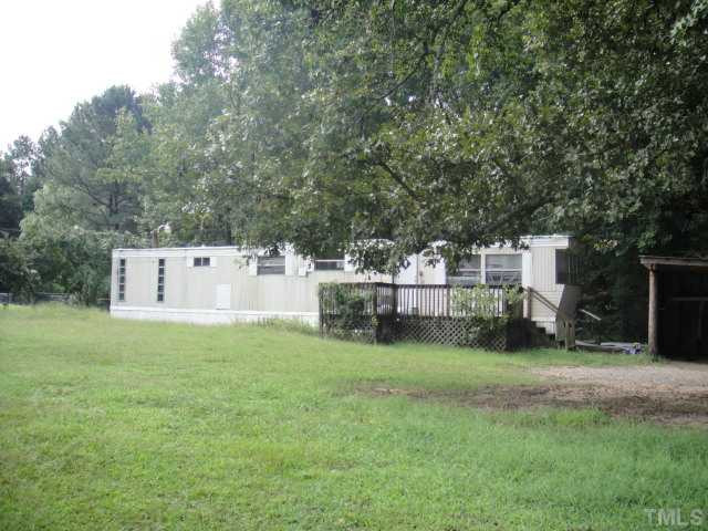 Napoleon Road Selma, NC 27576 - Photo 1 of 4 This picture shows an older mobile home that can remain and/or be removed. The price reflects the lot portion only. which is 1.31 AC. Land