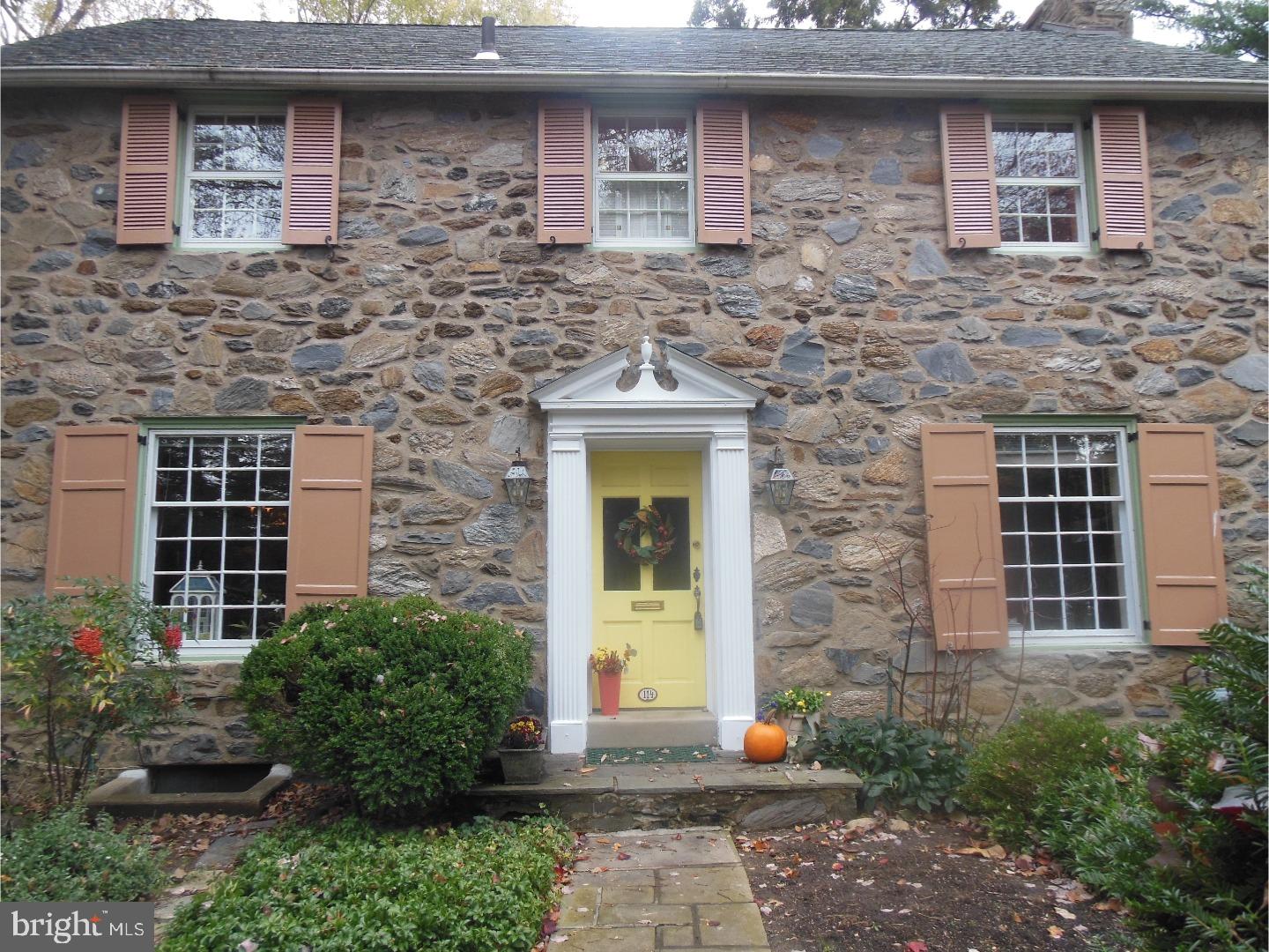 114 Stratford Road Wallingford, PA 19086 - Photo 1 of 25 a stone house with a outdoor space