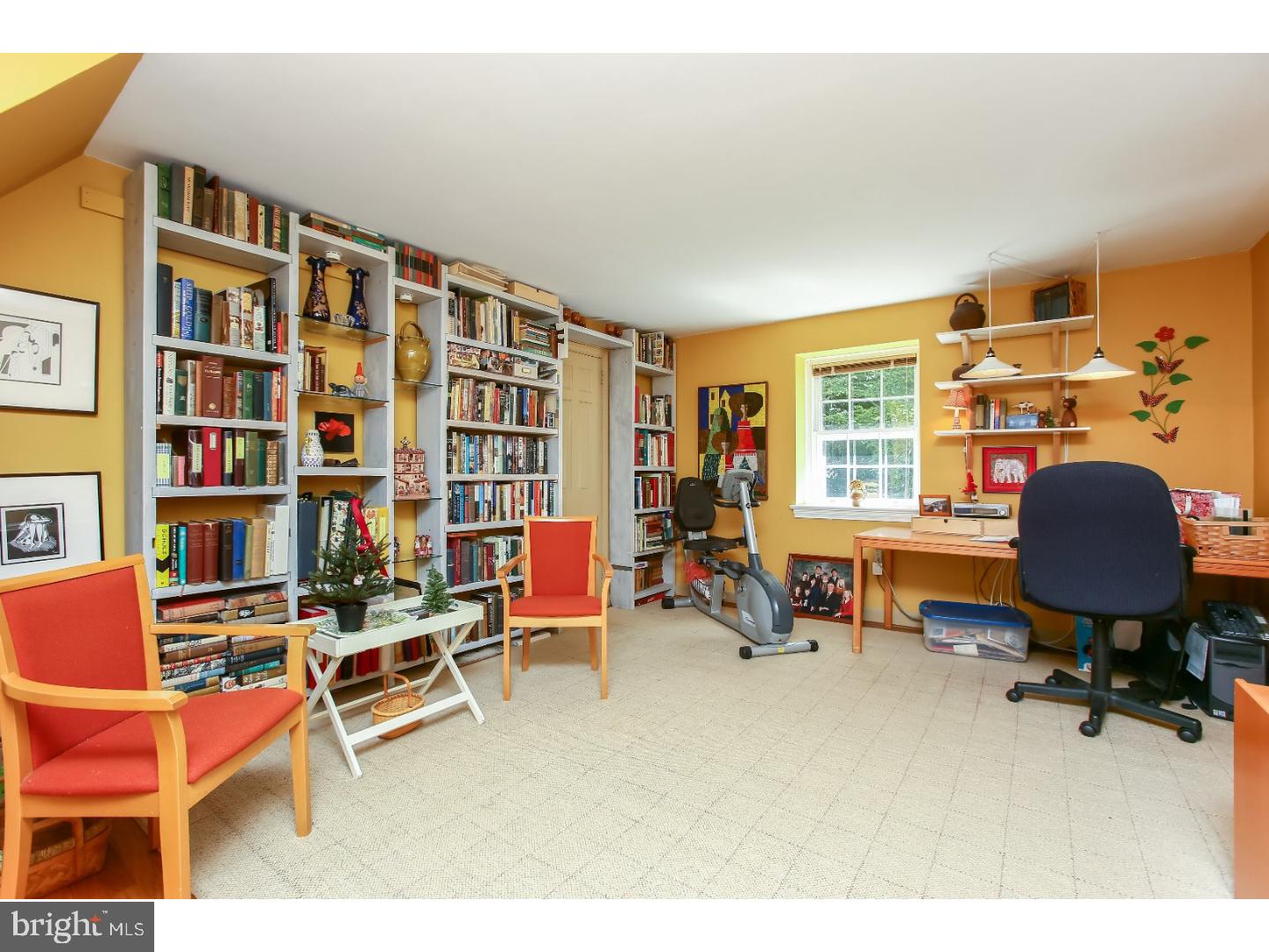 114 Stratford Road Wallingford, PA 19086 - Photo 15 of 25 a living room with furniture and a book shelf