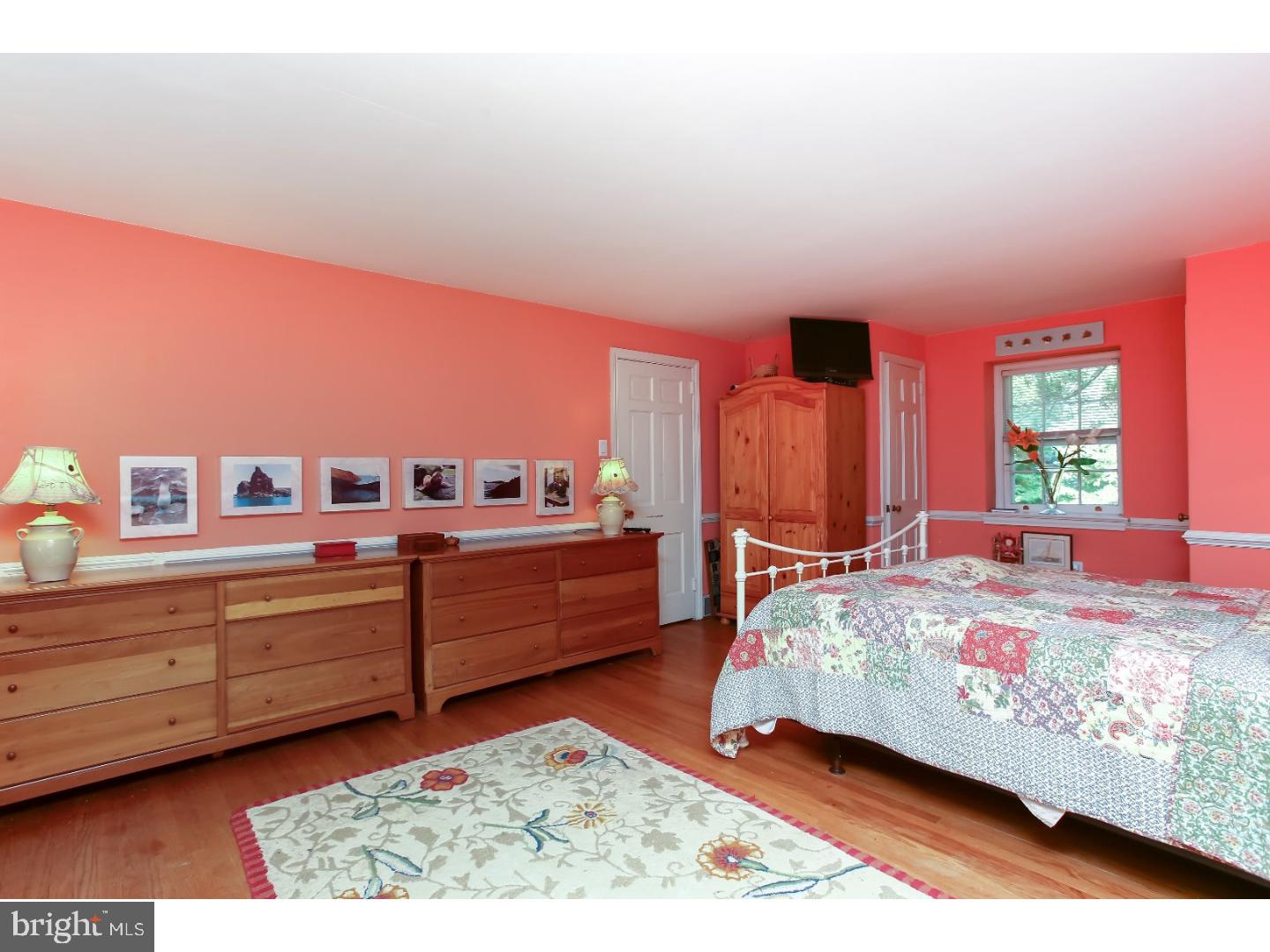 114 Stratford Road Wallingford, PA 19086 - Photo 16 of 25 a bed room with a bed and a chair