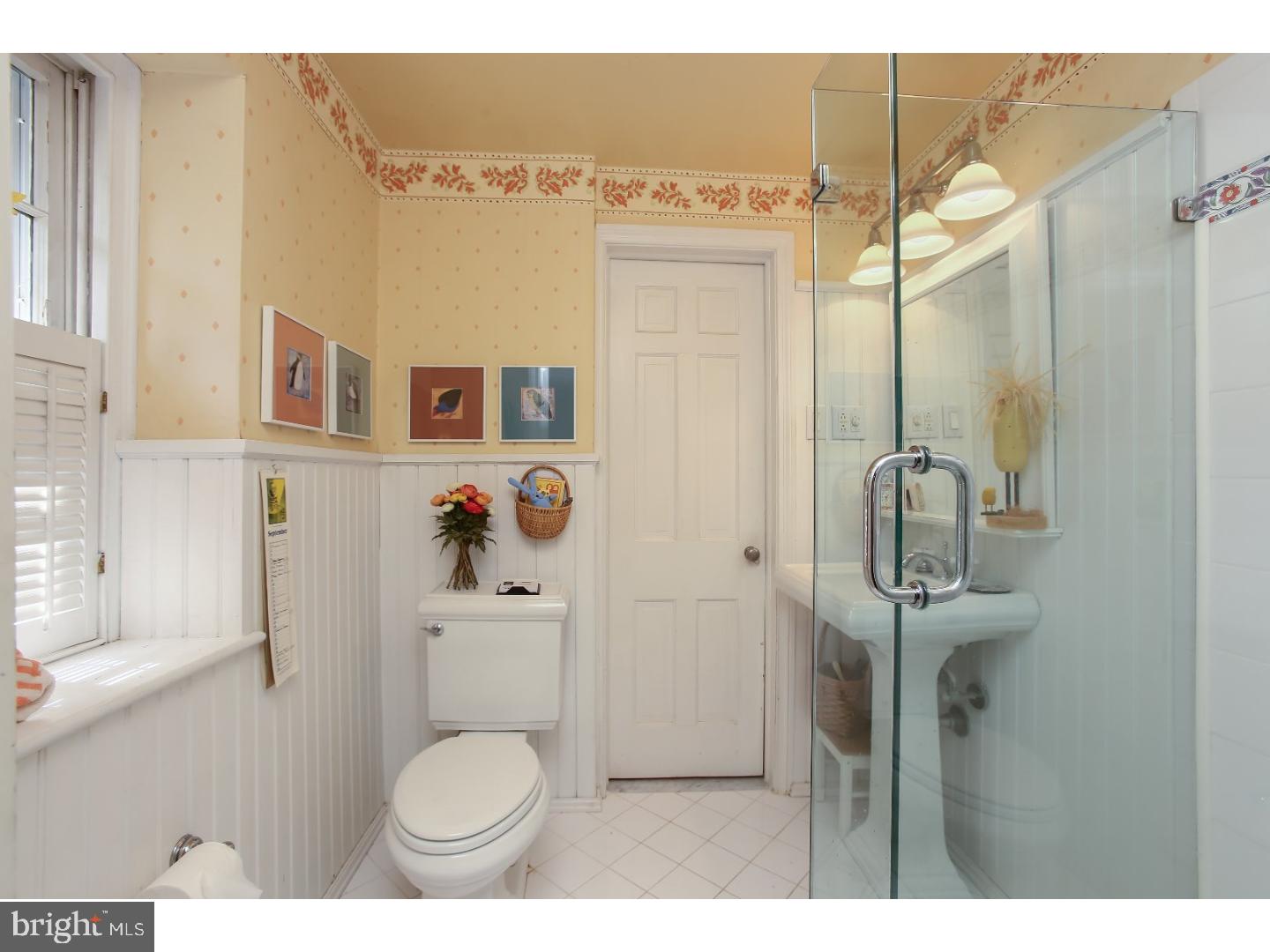 114 Stratford Road Wallingford, PA 19086 - Photo 17 of 25 a bathroom with a toilet sink and mirror