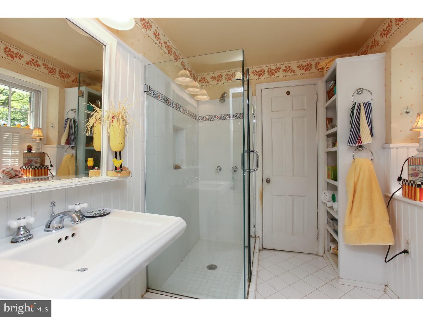 114 Stratford Road Wallingford, PA 19086 - Photo 18 of 25 a bathroom with a sink vanity and a mirror