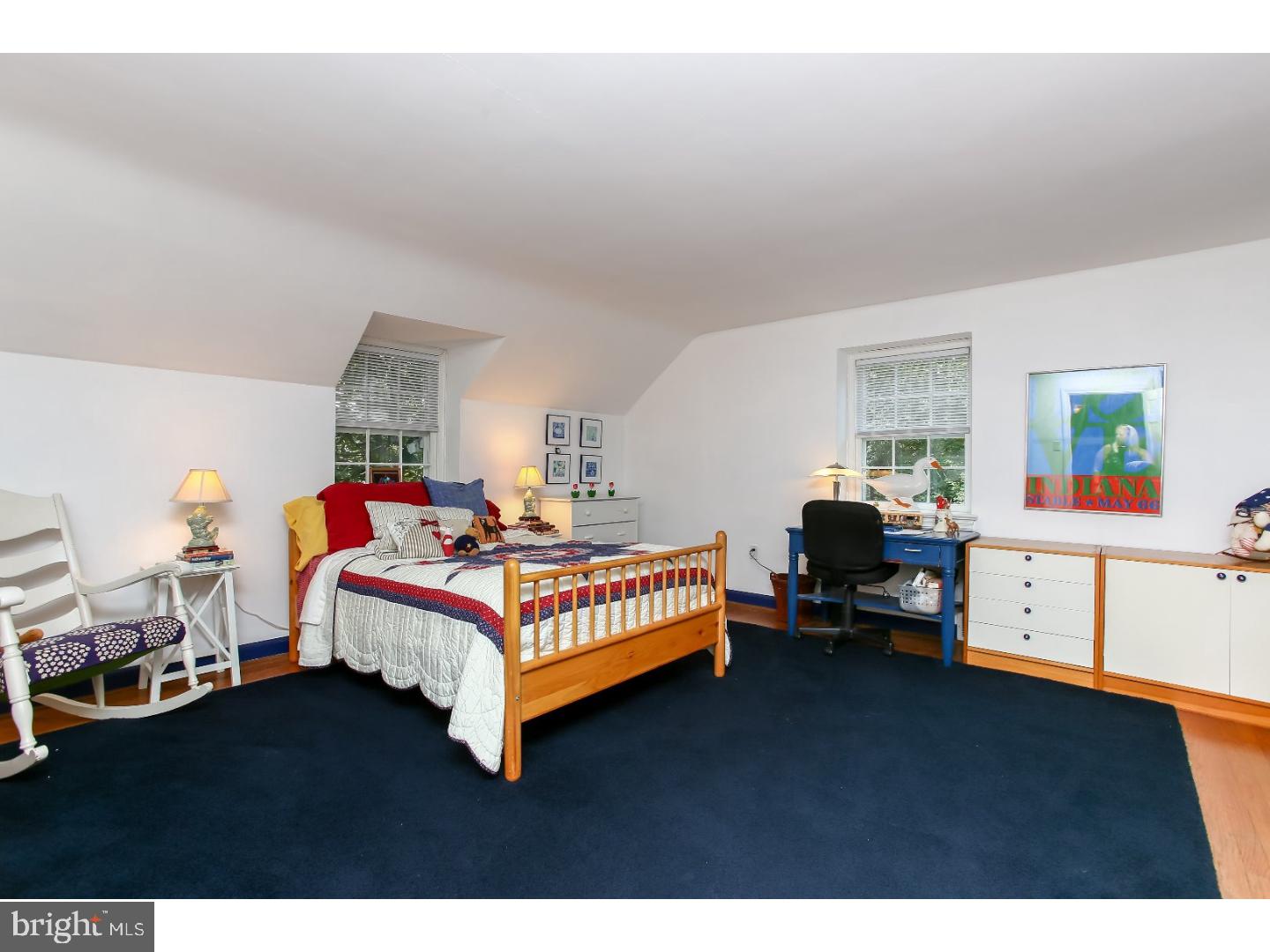 114 Stratford Road Wallingford, PA 19086 - Photo 19 of 25 a bedroom with a bed and a dresser in it