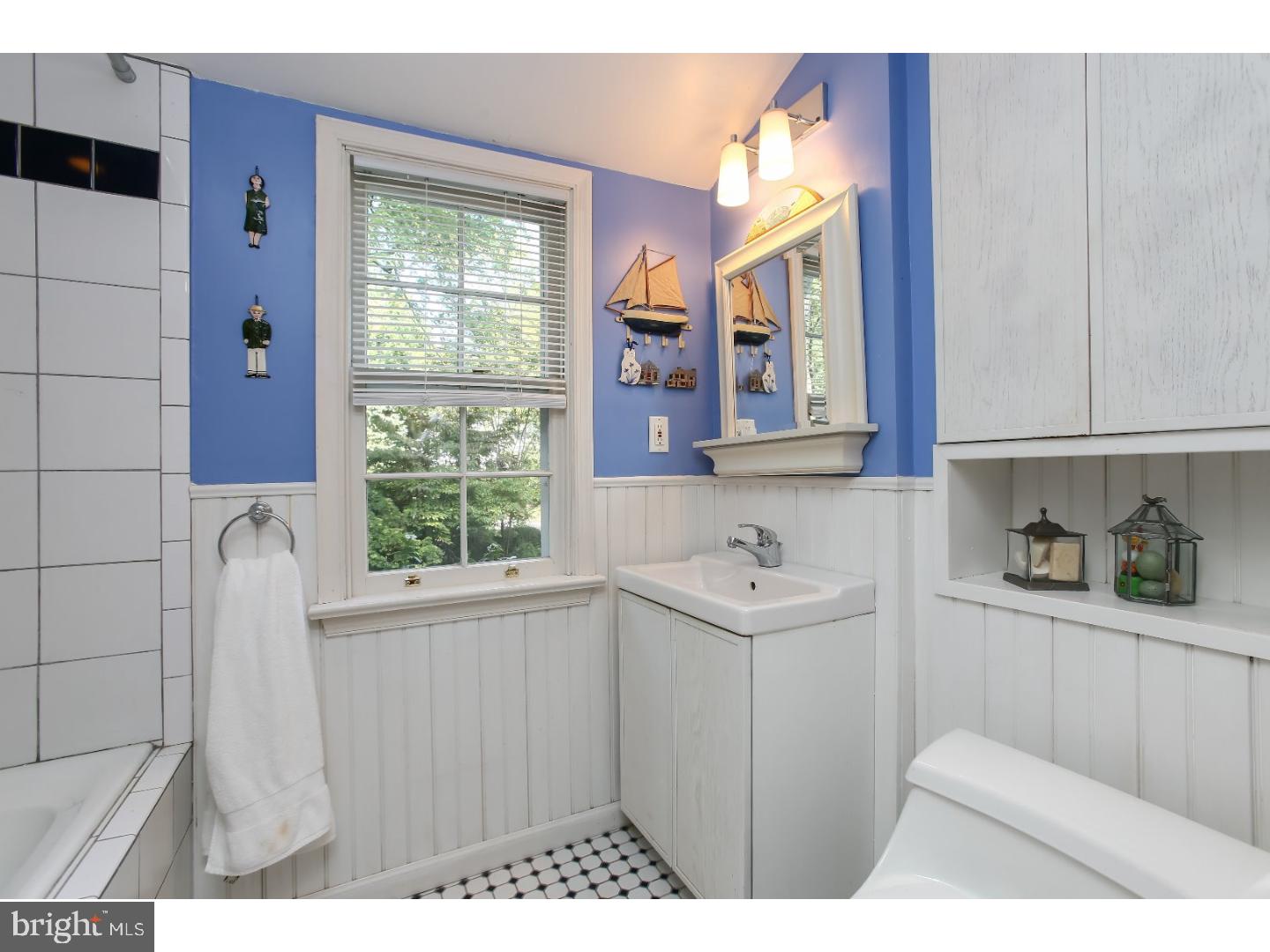 114 Stratford Road Wallingford, PA 19086 - Photo 21 of 25 a kitchen with a sink a window and cabinets