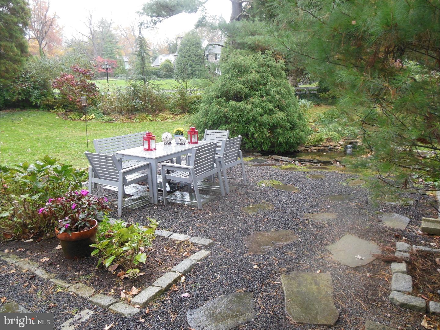 114 Stratford Road Wallingford, PA 19086 - Photo 24 of 25 a view of a patio with table and chairs and potted plants