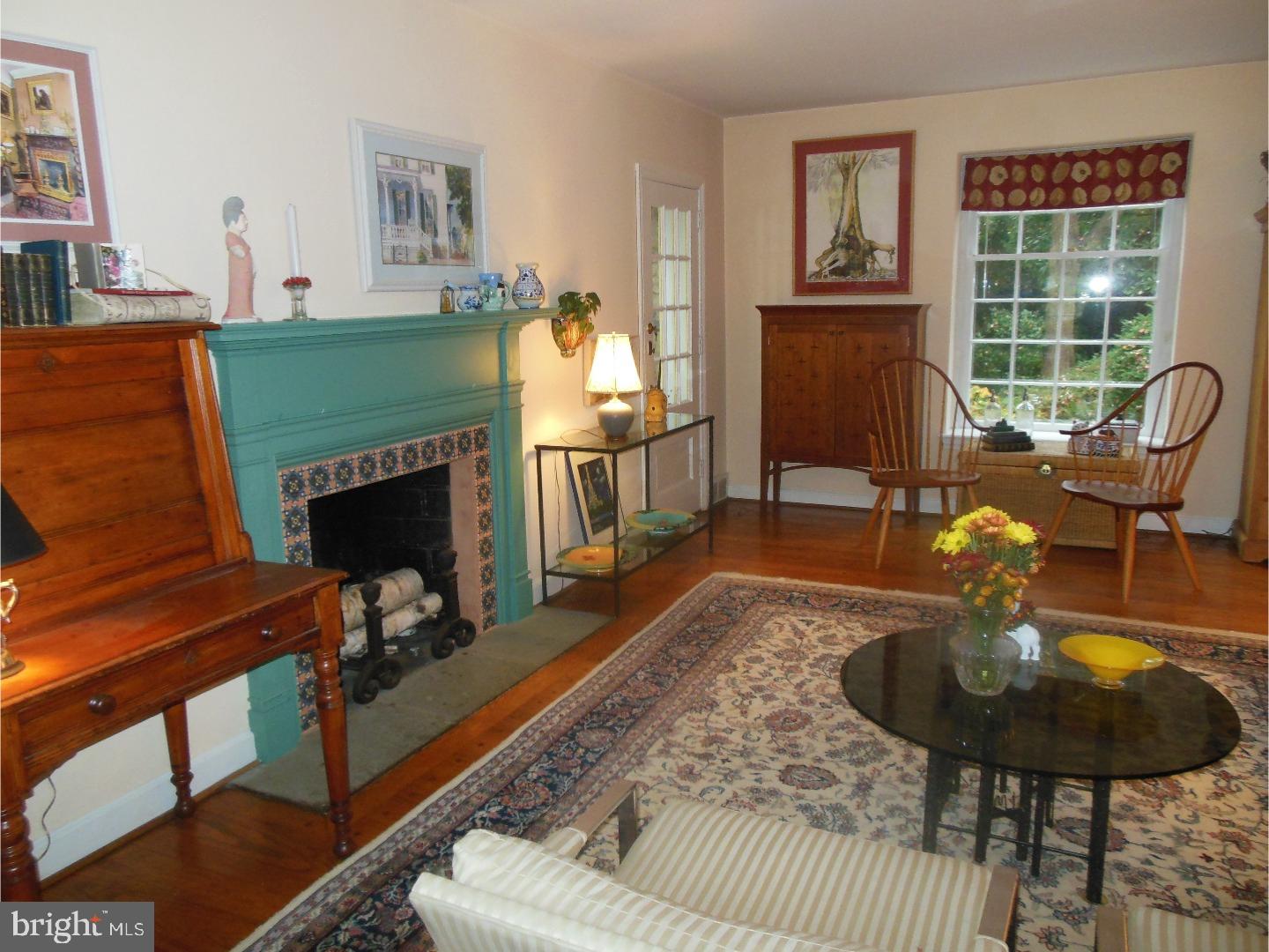 114 Stratford Road Wallingford, PA 19086 - Photo 5 of 25 a living room with furniture and a fireplace