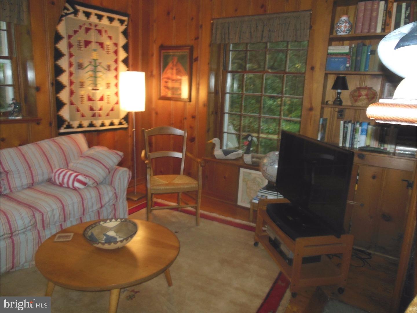 114 Stratford Road Wallingford, PA 19086 - Photo 8 of 25 a living room with furniture and a fireplace