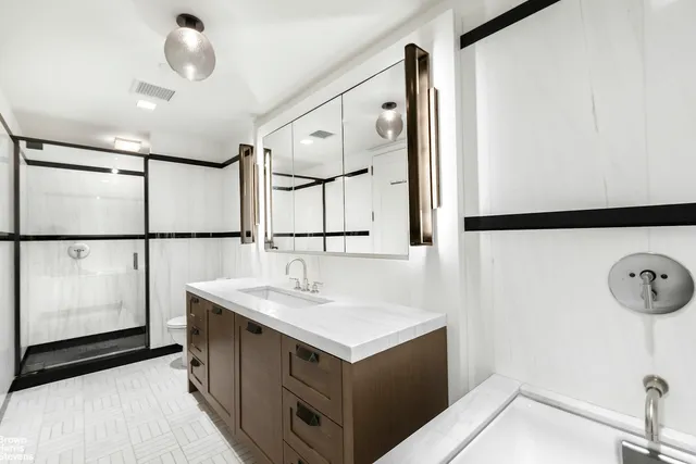 a bedroom with a large bed and a large window