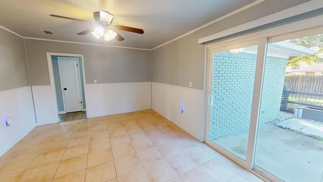 a view of an empty room and window