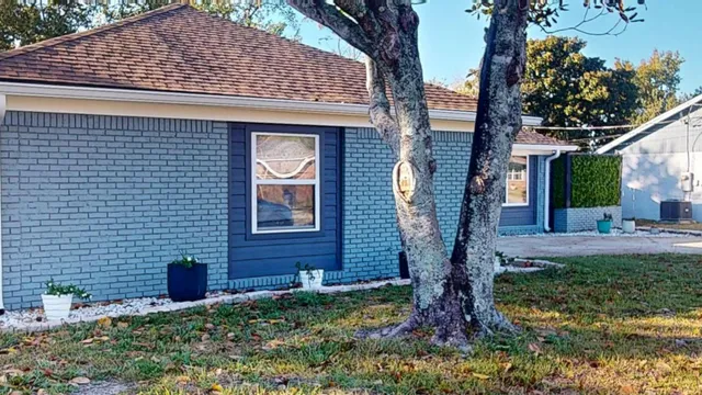 a front view of a house with garden