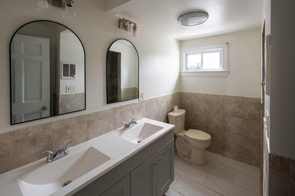 281 Beach Street, Unit 2 Revere, MA 02151 - Photo 15 of 17 a bathroom with a sink and a mirror