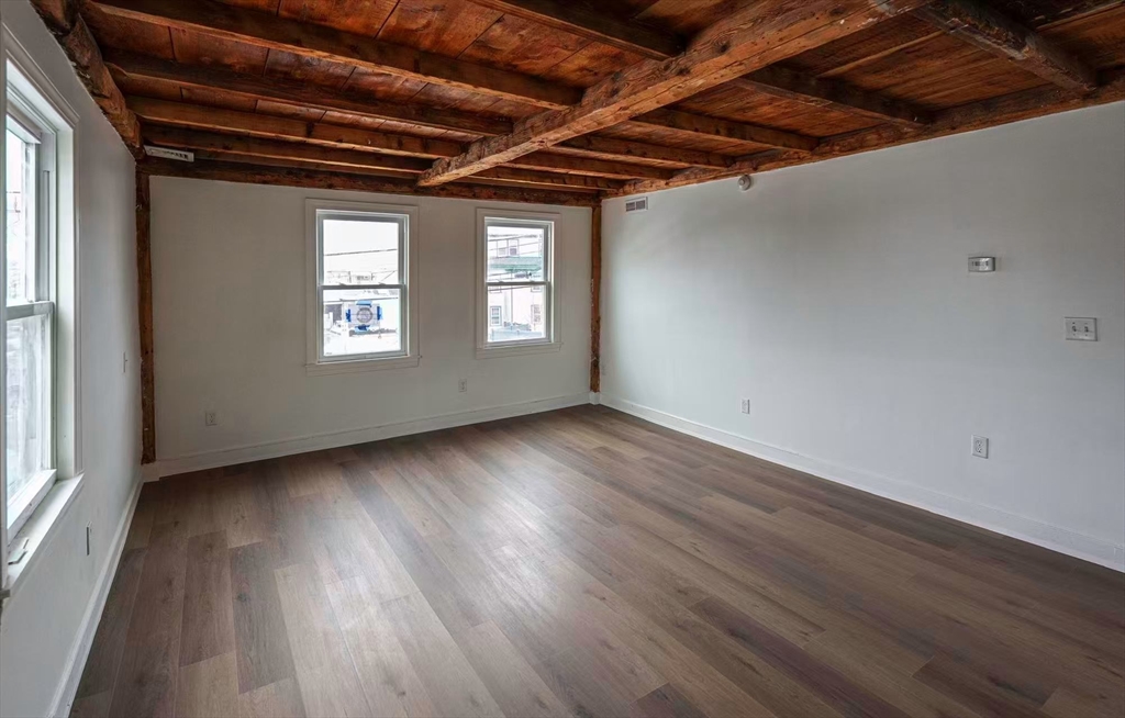 281 Beach Street, Unit 2 Revere, MA 02151 - Photo 5 of 17 a view of a room with wooden floors and roof