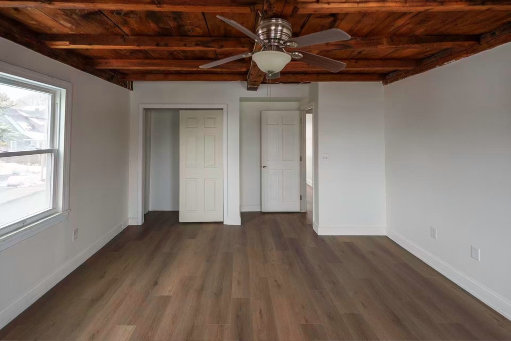 281 Beach Street, Unit 2 Revere, MA 02151 - Photo 9 of 17 a view of an empty room with wooden floor and a window