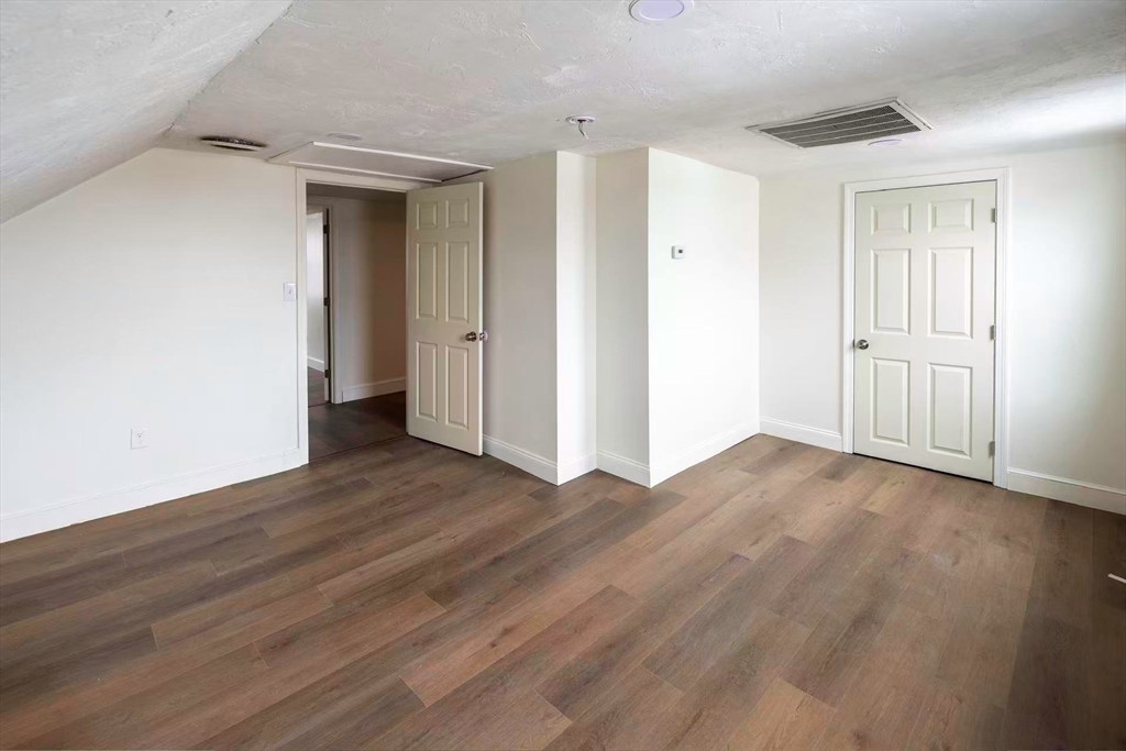 281 Beach Street, Unit 2 Revere, MA 02151 - Photo 10 of 17 a view of a room with wooden floor and bathroom