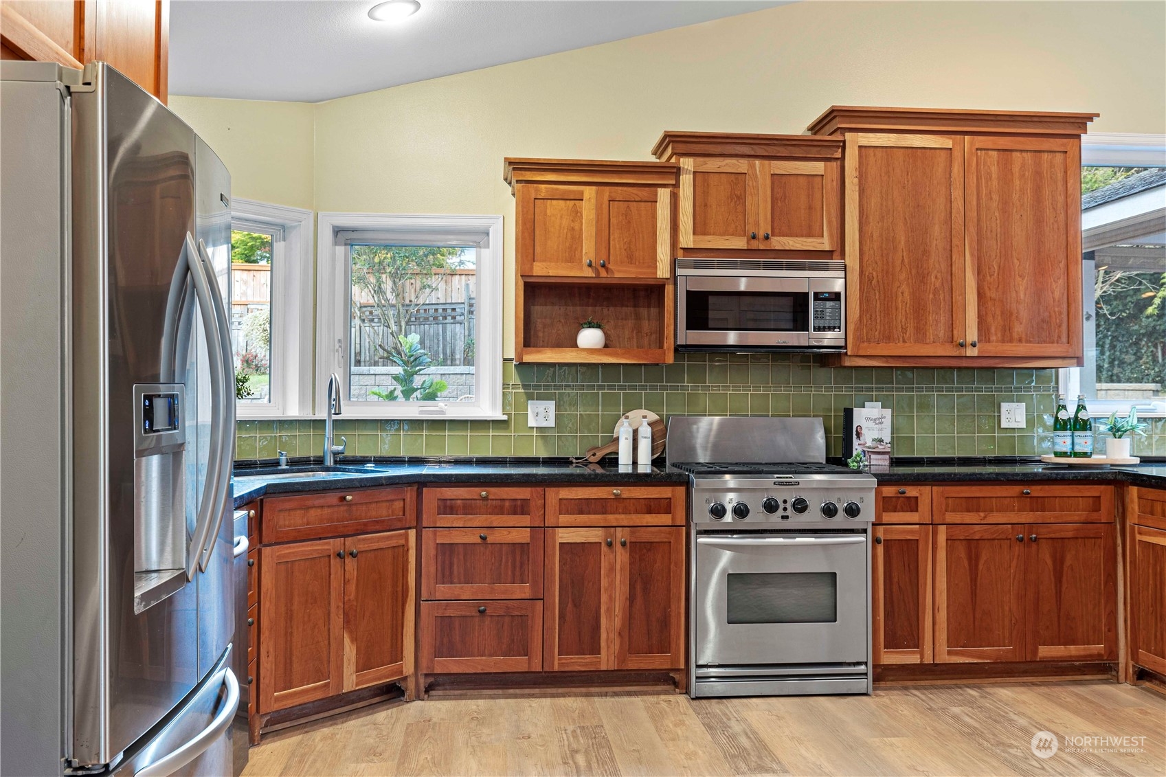 400 Park Place Everett, WA 98203 - Photo 17 of 40 a kitchen with stainless steel appliances granite countertop a stove top oven a sink and dishwasher