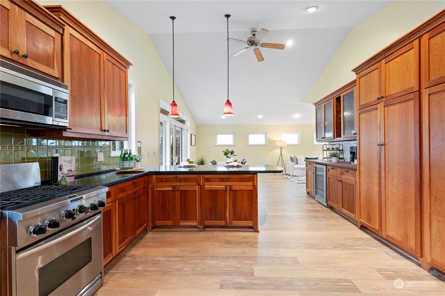 400 Park Place Everett, WA 98203 - Photo 18 of 40 a kitchen with stainless steel appliances granite countertop a stove a sink dishwasher and a microwave oven with wooden cabinets