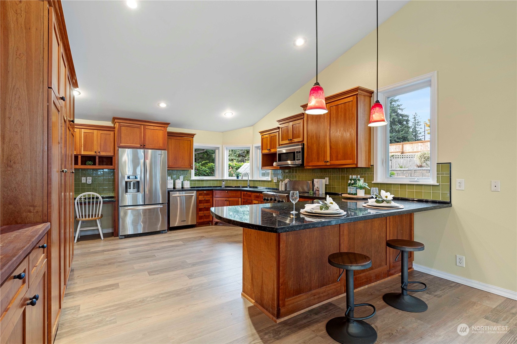 400 Park Place Everett, WA 98203 - Photo 19 of 40 a kitchen with refrigerator and chairs