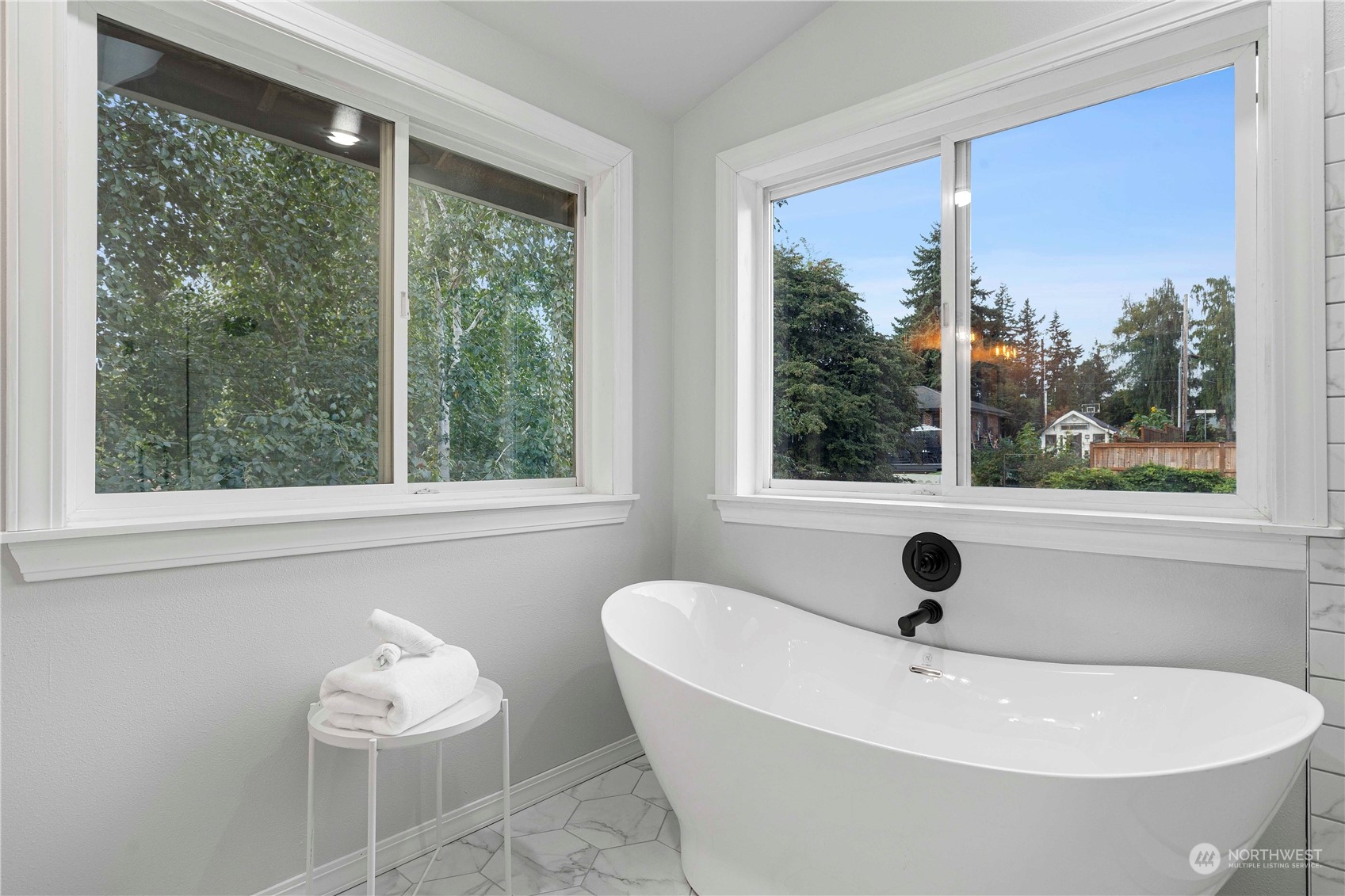 400 Park Place Everett, WA 98203 - Photo 29 of 40 a white bath tub sitting in a bathroom next to a window