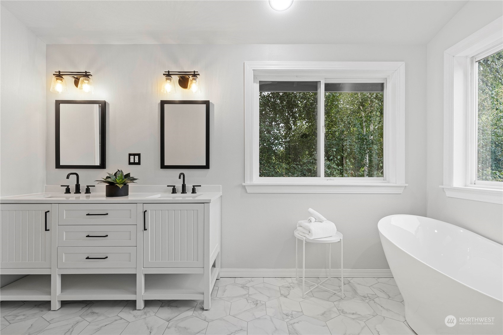 400 Park Place Everett, WA 98203 - Photo 31 of 40 a bathroom with a double vanity sink a mirror and a bathtub