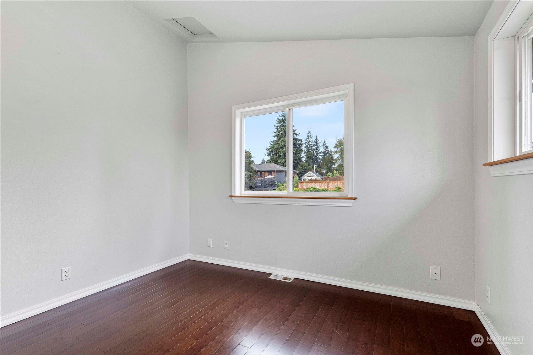 400 Park Place Everett, WA 98203 - Photo 33 of 40 a view of an empty room with wooden floor and a window