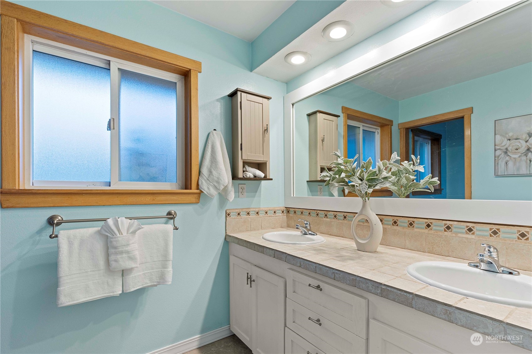 400 Park Place Everett, WA 98203 - Photo 37 of 40 a bathroom with a double vanity sink and a mirror