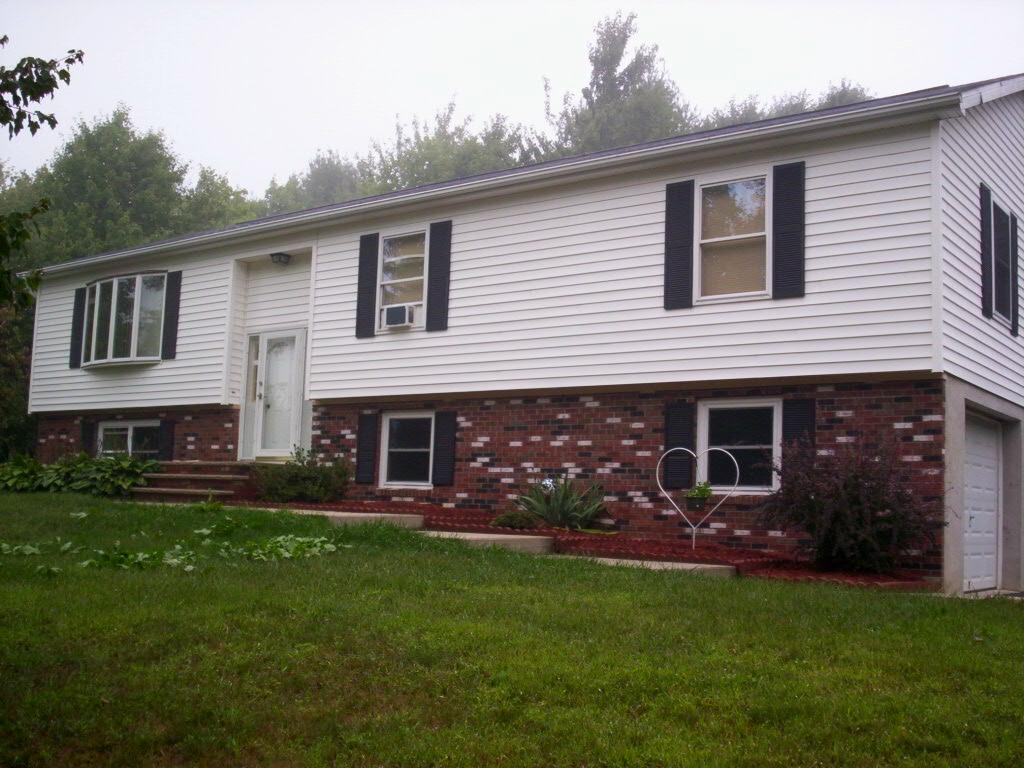 67 Comanche Pines Road Effort, PA 18330 - Photo 2 of 4 a front view of a house with garden