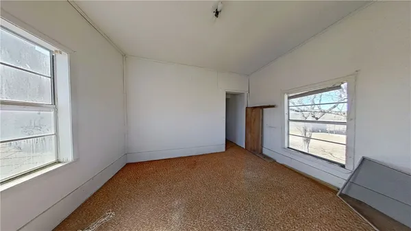 an empty room with windows