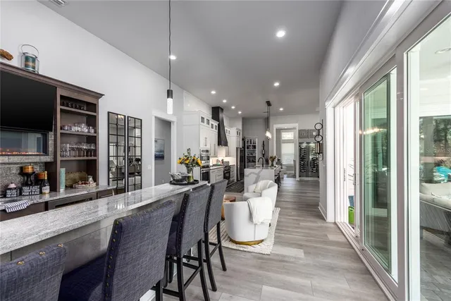 a bedroom with furniture and a flat screen tv