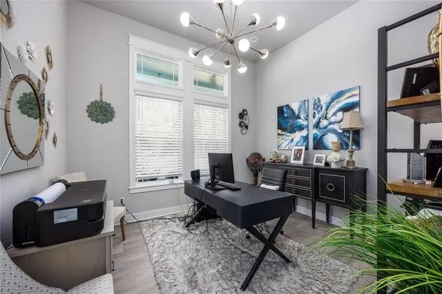 a spacious bathroom with double vanity and a large mirror