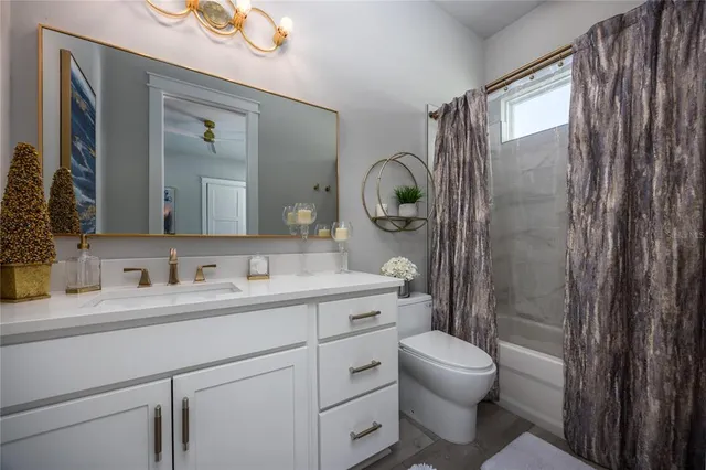 a bedroom with bed couch and window