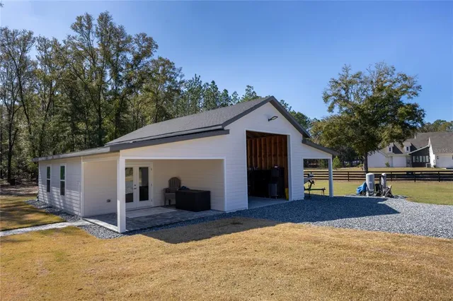 a view of a chairs and fire pit in the patio