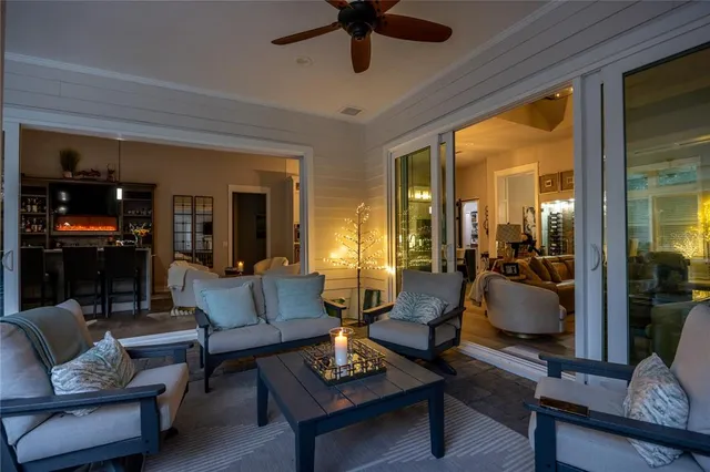 a view of a house with backyard and sitting area