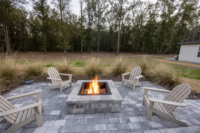 a front view of a house with a garden and yard