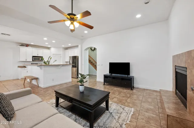 a living room with furniture and a fireplace