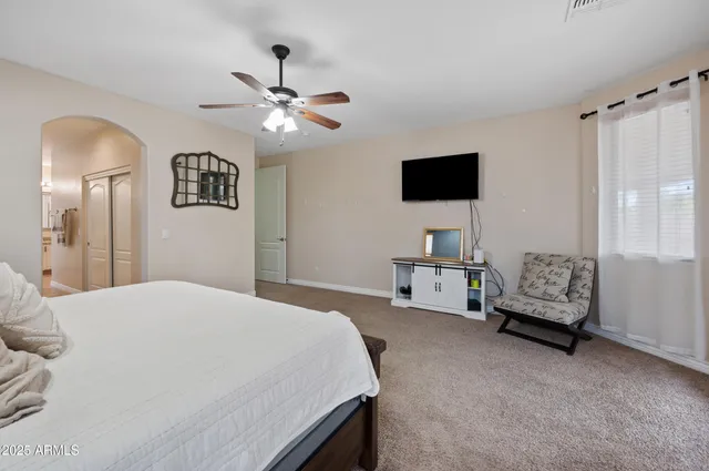 a bed room with a bed and a window