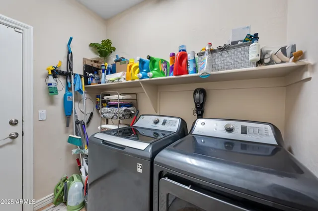 a spacious bathroom with a tub sink and mirror