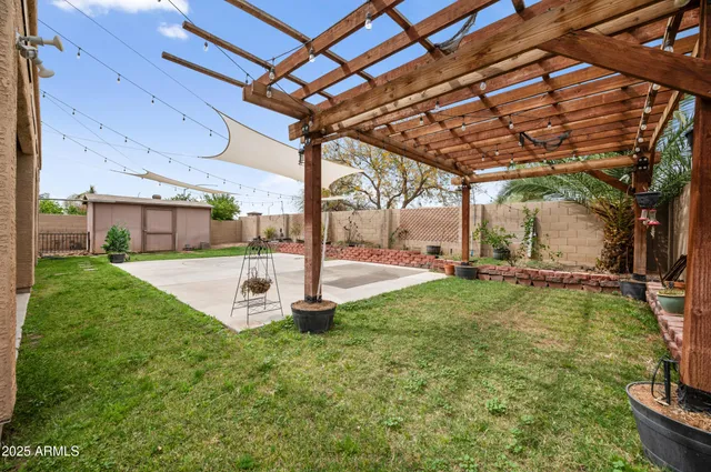 a view of a house with swimming pool and a yard