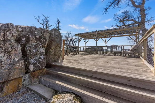 a view of a chairs and table in the patio
