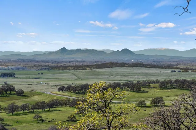 a view of a chairs on the roof deck