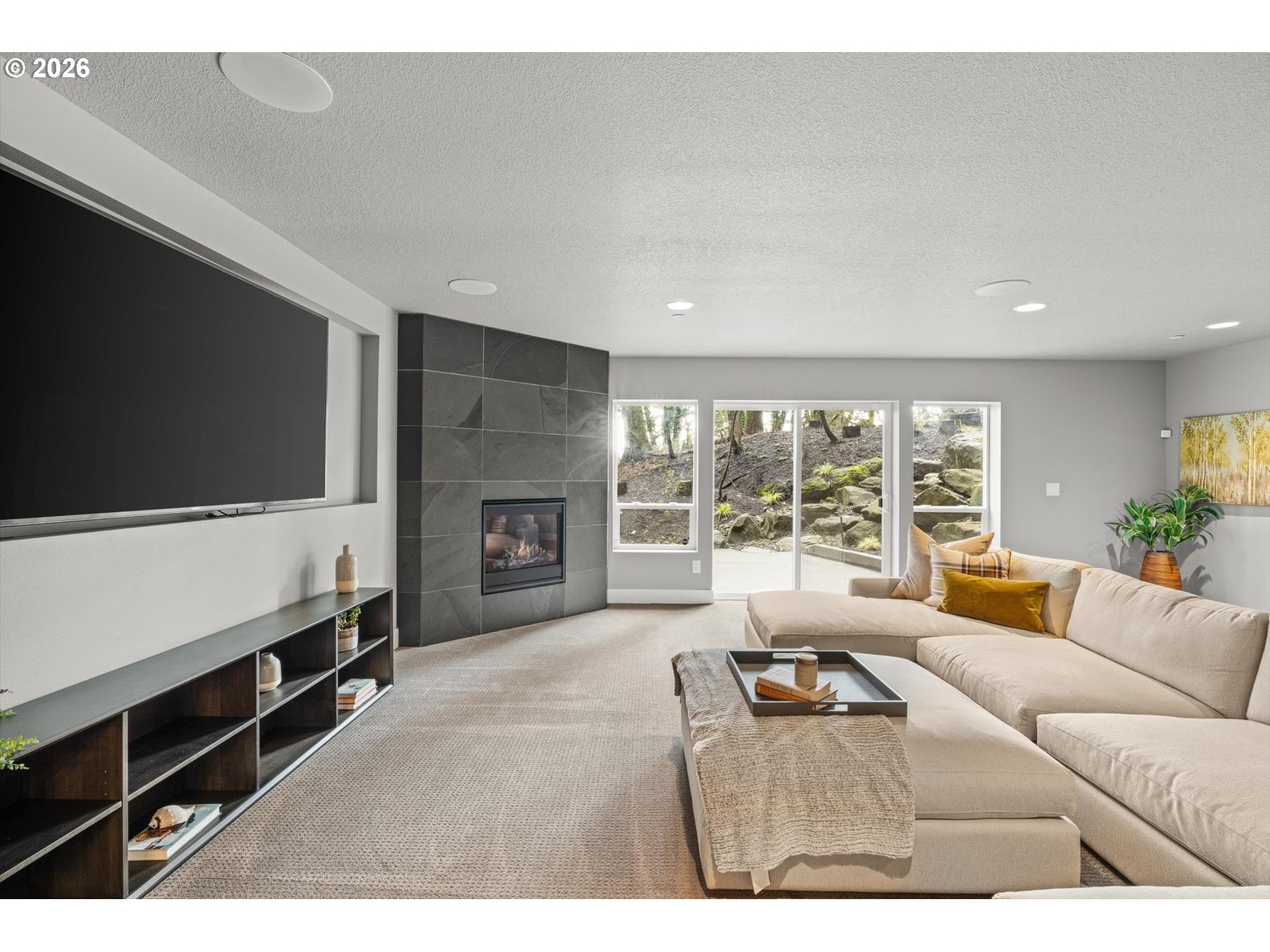 2193 Northeast 3rd Avenue Camas, WA 98607 - Photo 29 of 32 a living room with furniture tv and a fireplace