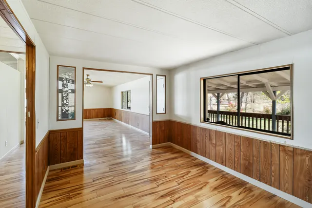 a view of an entryway with wooden floor