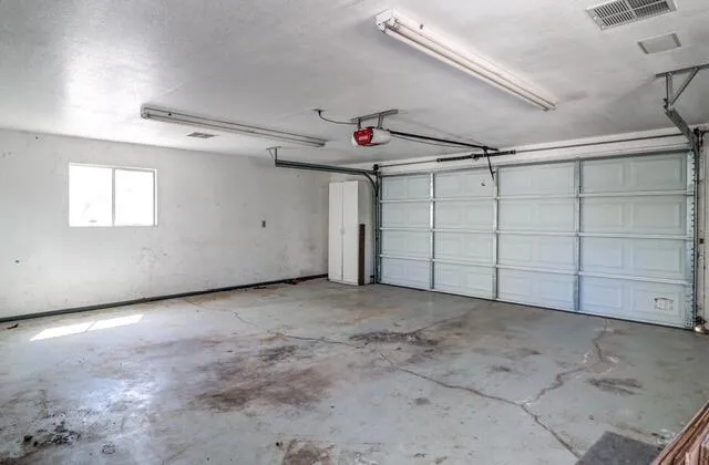 a view of a livingroom with furniture and ceiling fan