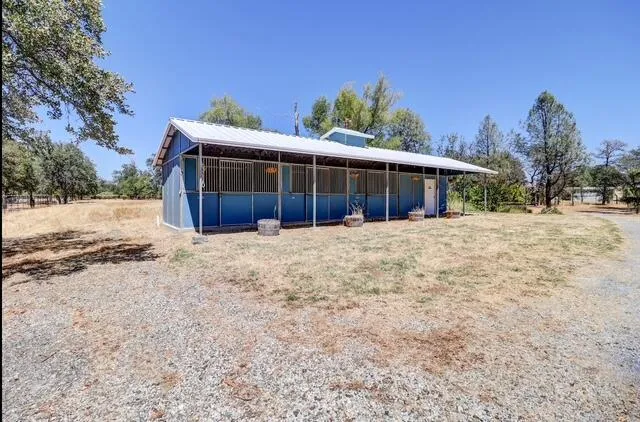 a view of a house with a snow on the road