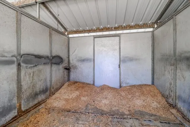 a view of a room with door and wooden door