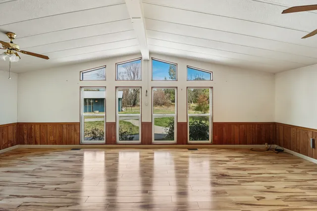 a view of a hardwood & staircase in an empty room