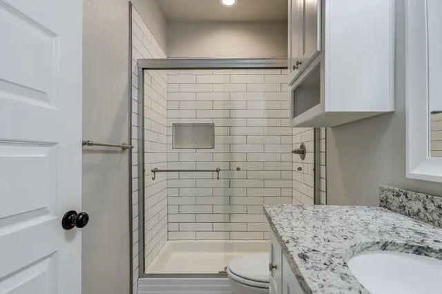 a bathroom with a sink and toilet