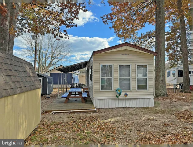 a front view of a house with yard