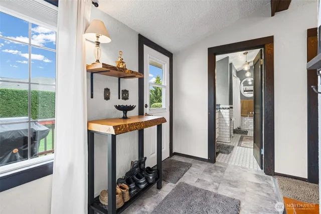 a dining room with furniture and window