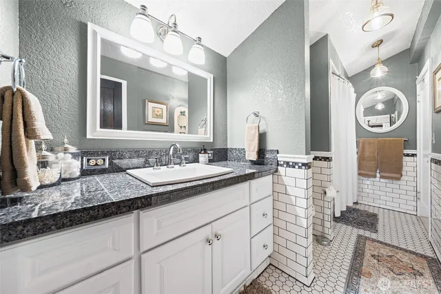 a living room with furniture and a rug