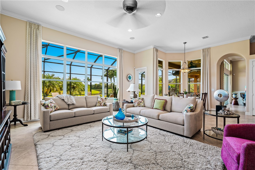 8250 Halbert Lane Vero Beach, FL 32968 - Photo 11 of 36 a living room with furniture and a large window